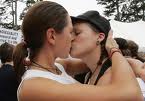 lesbian couple sharing kiss outdoors