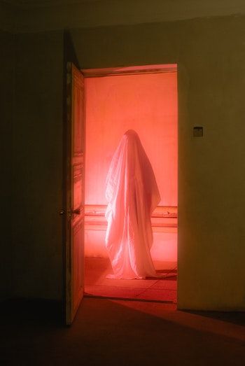 ghostly figure standing in doorway