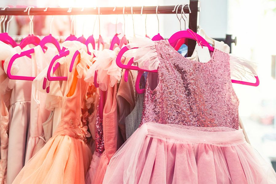 selection of girly dresses on hanger