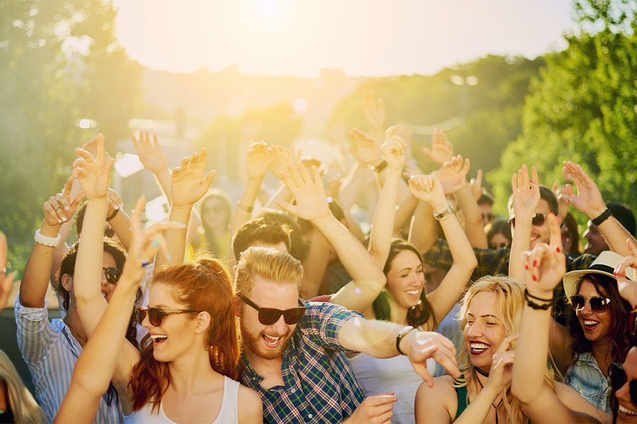 A group of concertgoers without masks