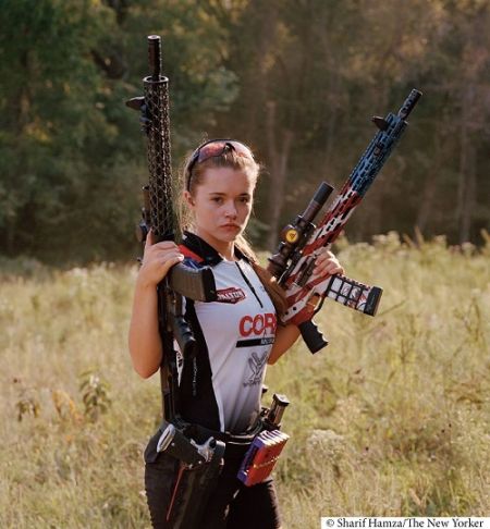 Female teen posing with guns