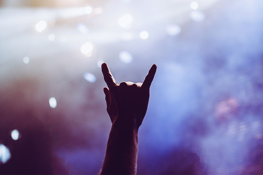 hand in horns symbol at metal concert