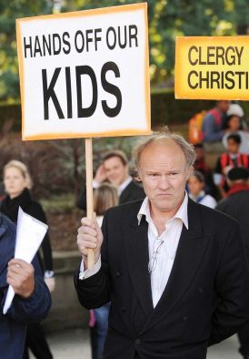 A man protesting sexual abuse in the Catholic Church.