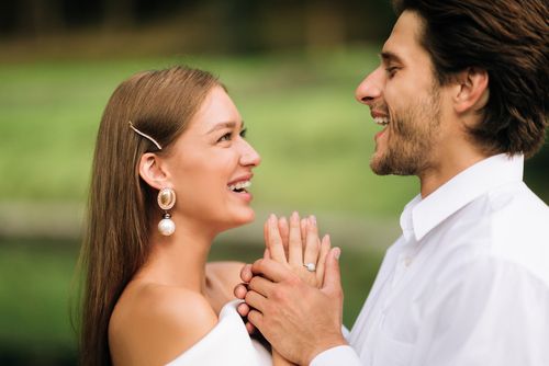 Happy Groom and Bride Holding Hands