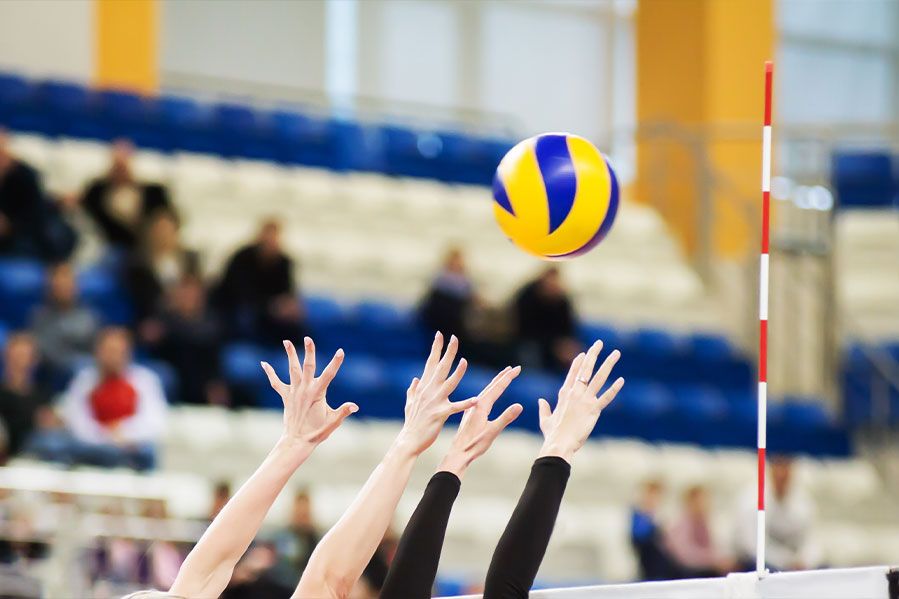 High school students playing volleyball