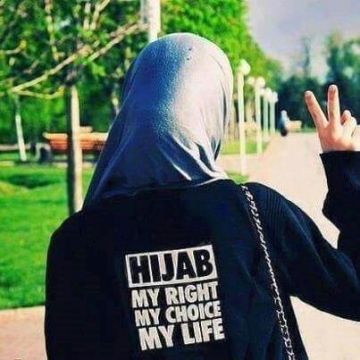 A woman protesting for her right to wear a hijab