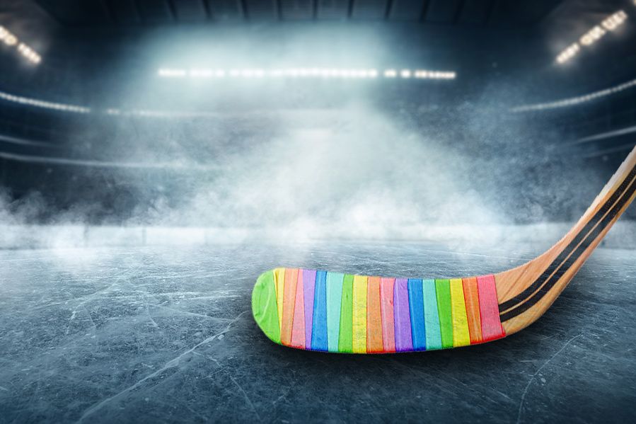 pride stick on NHL ice rink