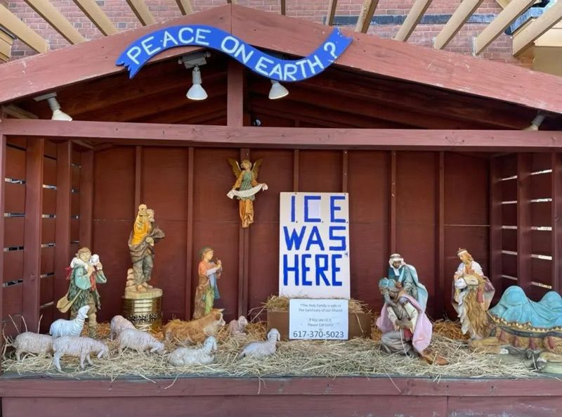 nativity scene with sign reading 'ICE was here' in place of jesus