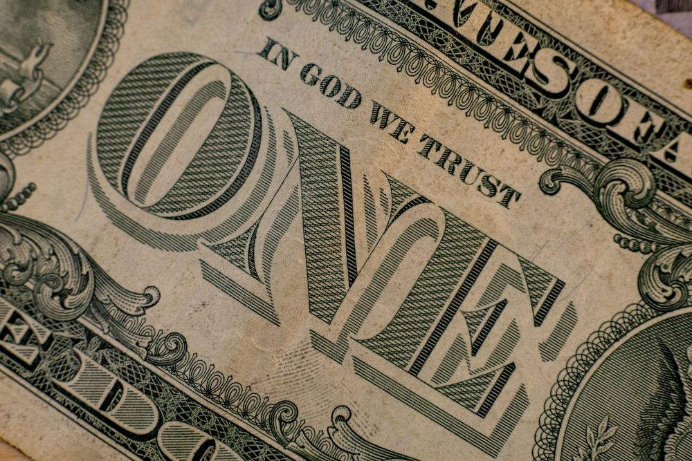 in god we trust written on dollar bill