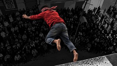 A digital illustration of a young man in a red sweater and jeans falling off of a rooftop.