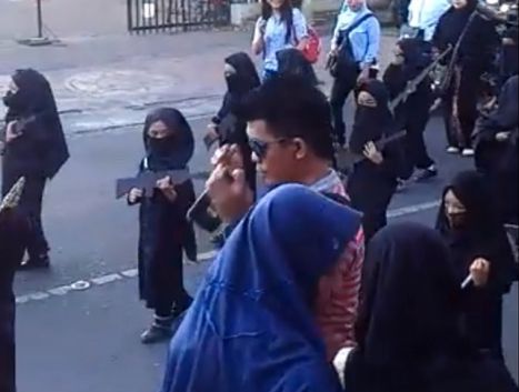 Youth dressed as ISIS soldiers in parade