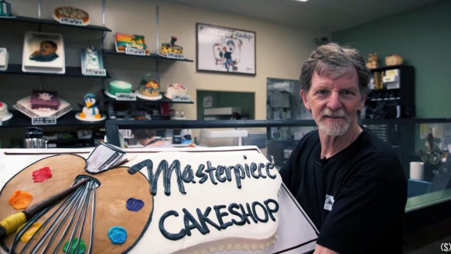 Jack Phillips posing in his cake shop