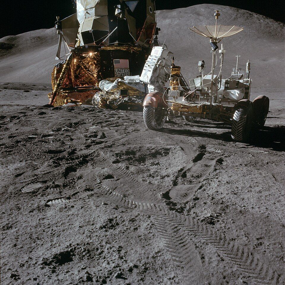 Apollo 15 astronaut James Irwin standing beside the lunar rover on the Moon in 1971.