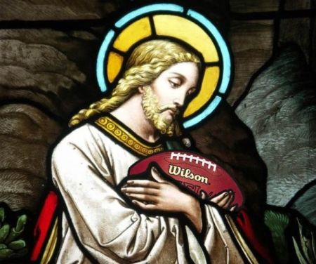 Jesus holding a football