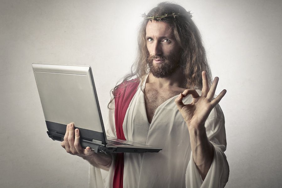 Jesus Christ using laptop