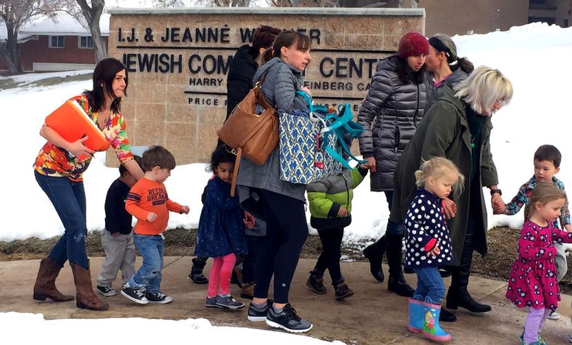 Jewish children evacuating a community center in the wake of bomb threats