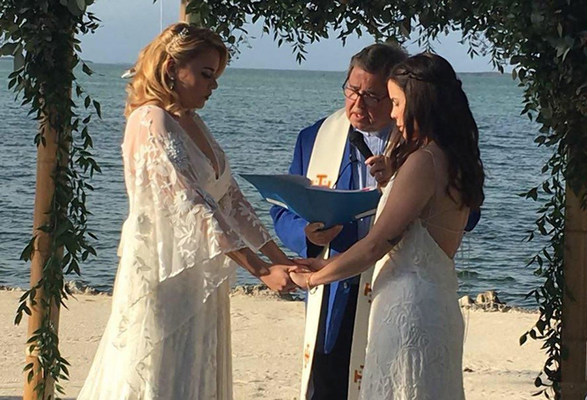 Gay Catholic teacher marries partner