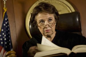 Female judge looking disapproving from bench