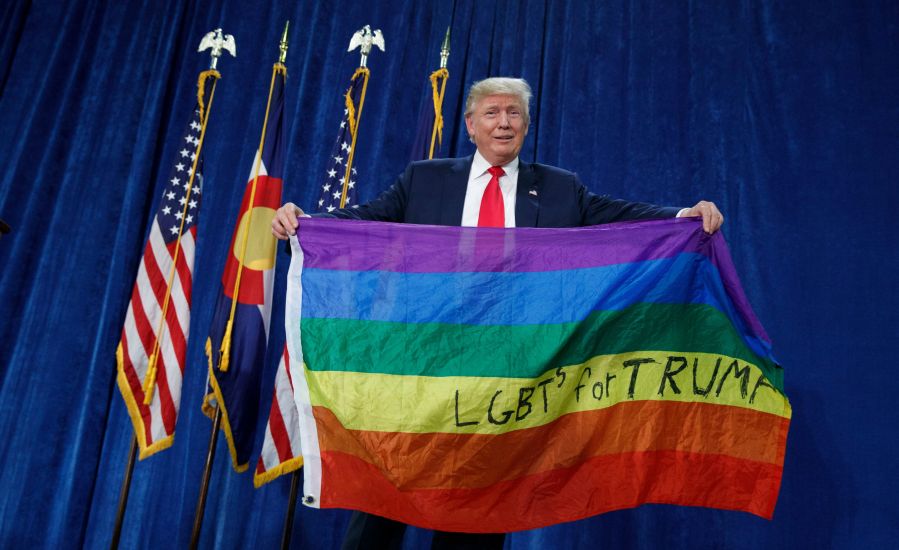 Trump holds an LGBT flag