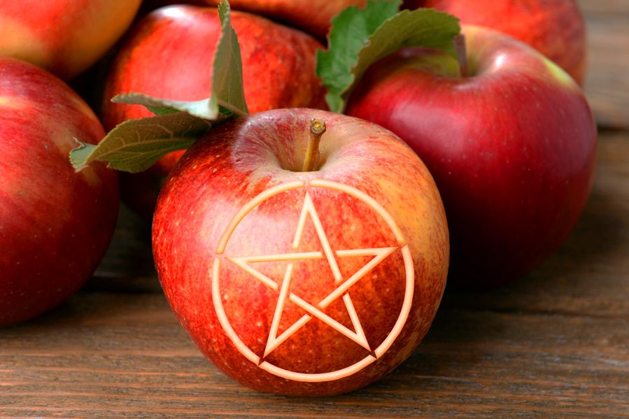 gala apple with pentagram carved into side in honor of mabon