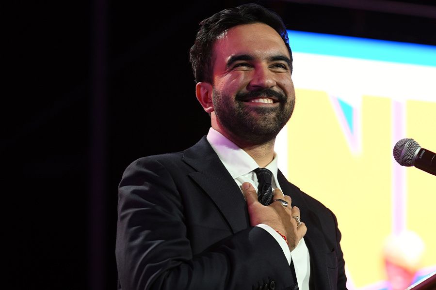 zohran mamdani with hand over heart