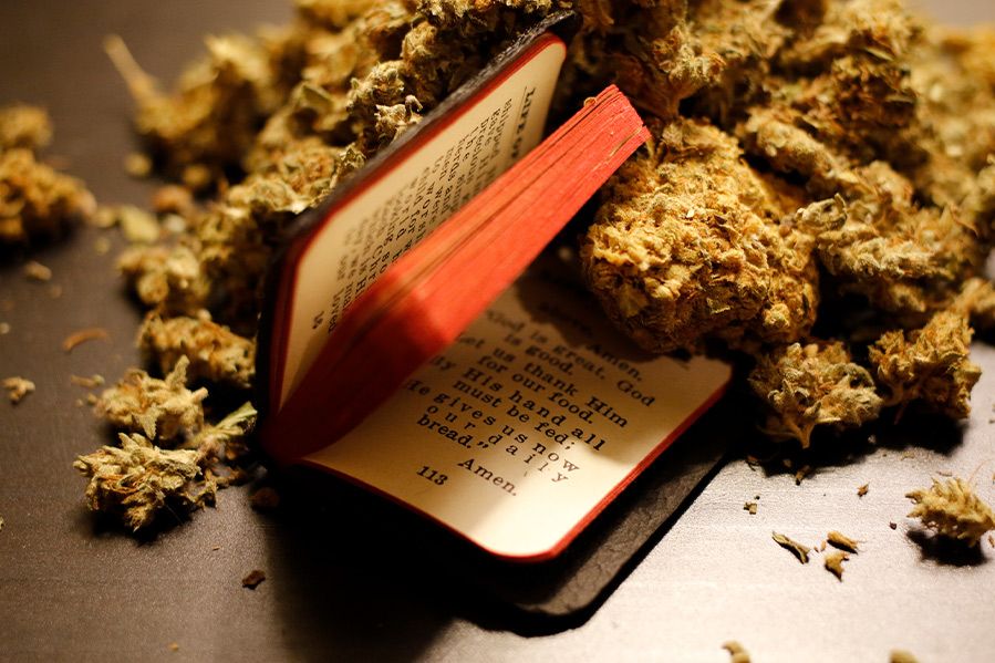 marijuana in-between pages of Bible