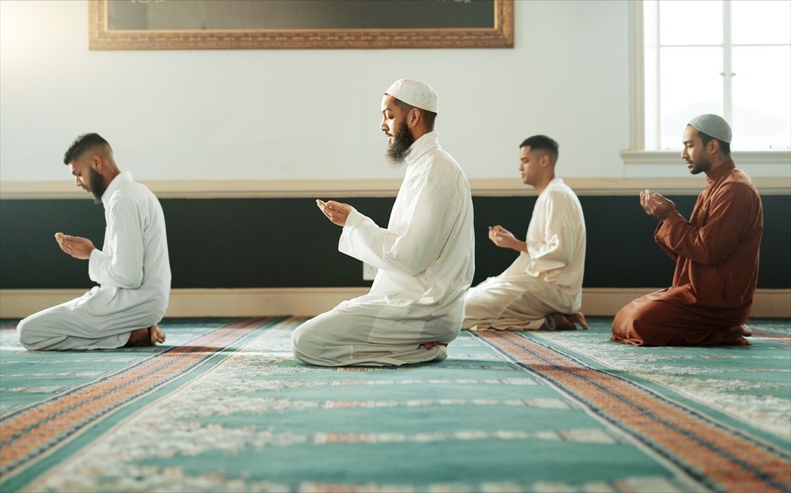Muslim men praying