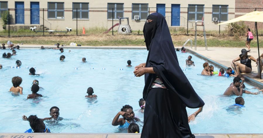 Muslim swimmers at a public pool