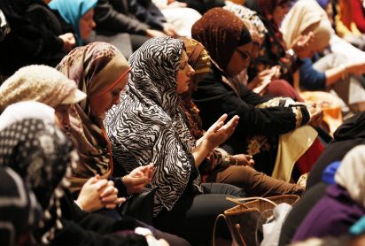 Muslim women praying in a mosque