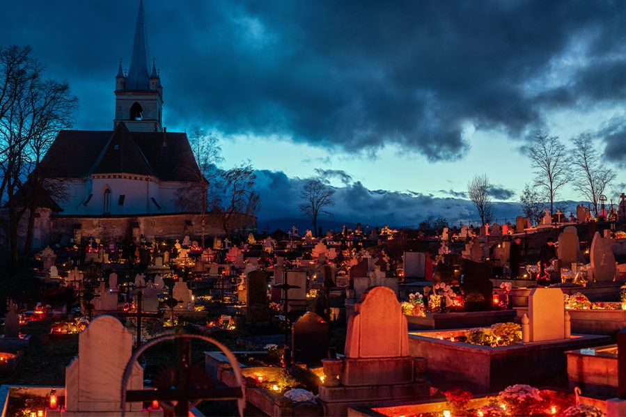catholic cemetery at night during all saints day