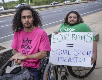 Disabled people protesting assisted suicide laws.