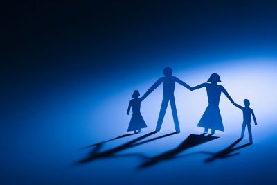 A paper cut-out of a mother, father, and two children