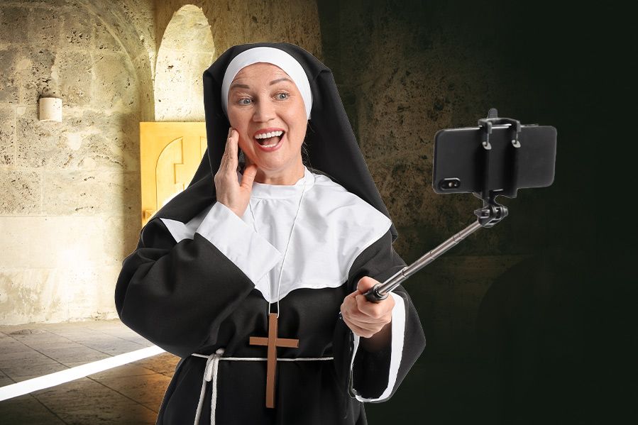 nun using selfie stick to take selfie