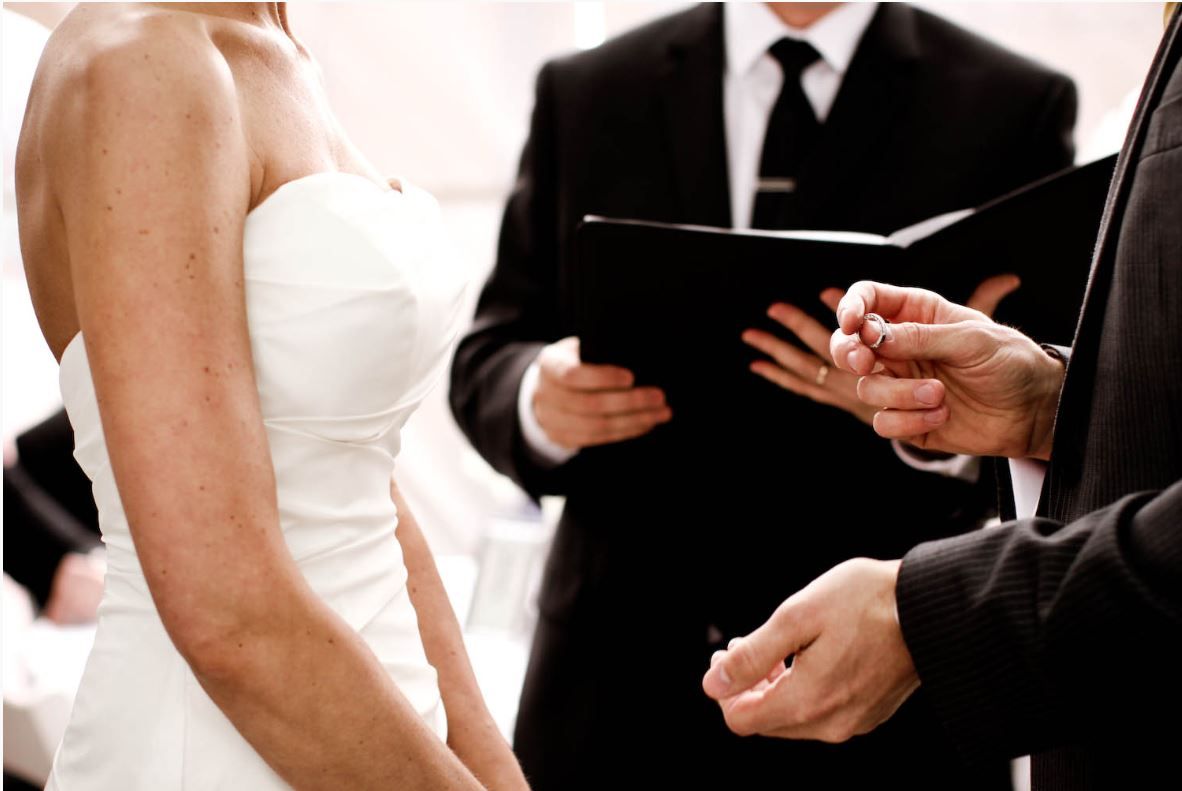 A wedding officiant performing the ceremony