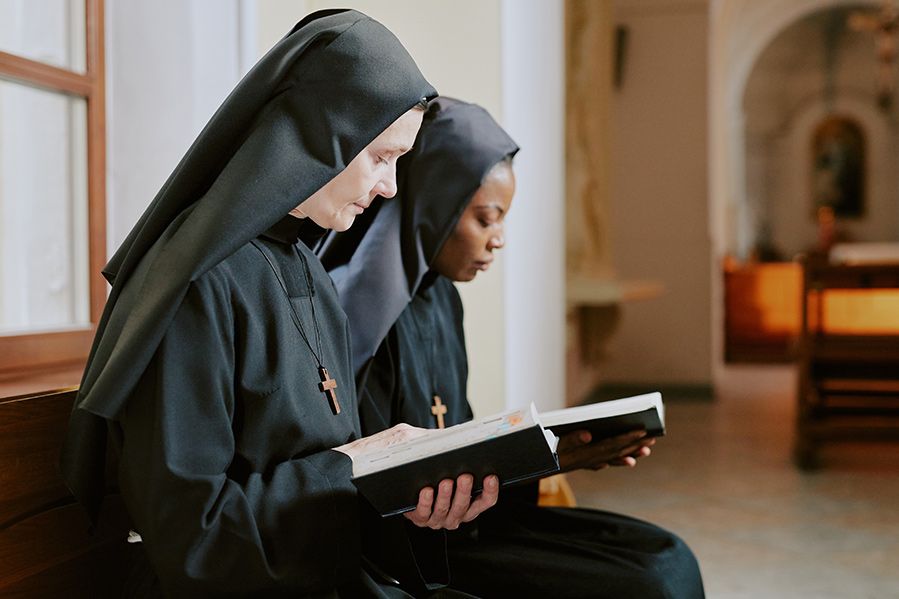 nuns reading bible in church