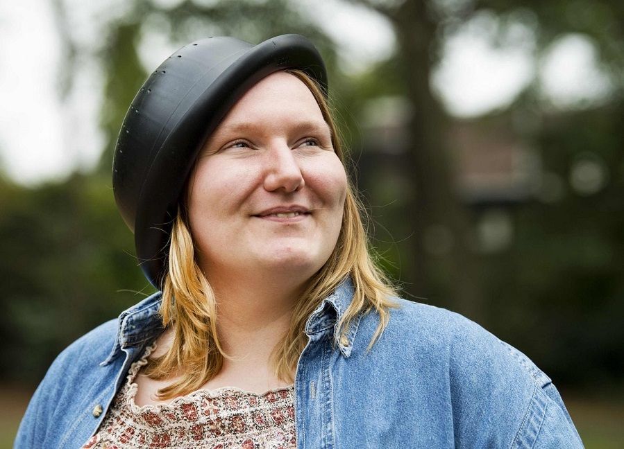 A Pastafarian woman wearing a colander