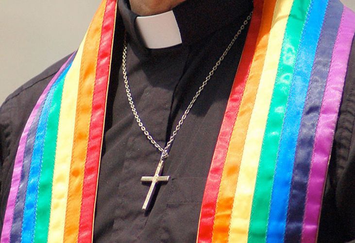 A pastor wearing the rainbow flag