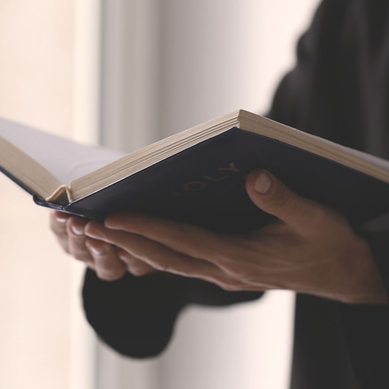 open bible being read by pastor in church