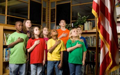 A group of kids saying the Pledge of Allegiance