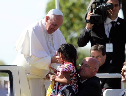 Pope Francis embracing immigration