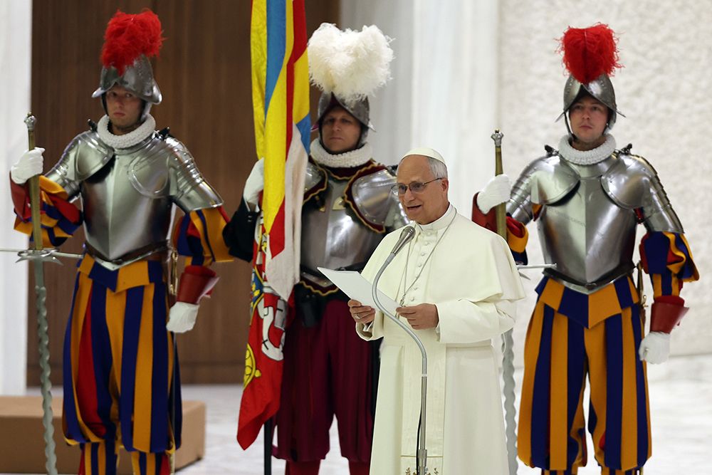 Pope Leo XIV delivers an address in front of his Swiss Guard, who are clad in medieval-style armor.