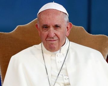 Pope Francis sitting in a chair