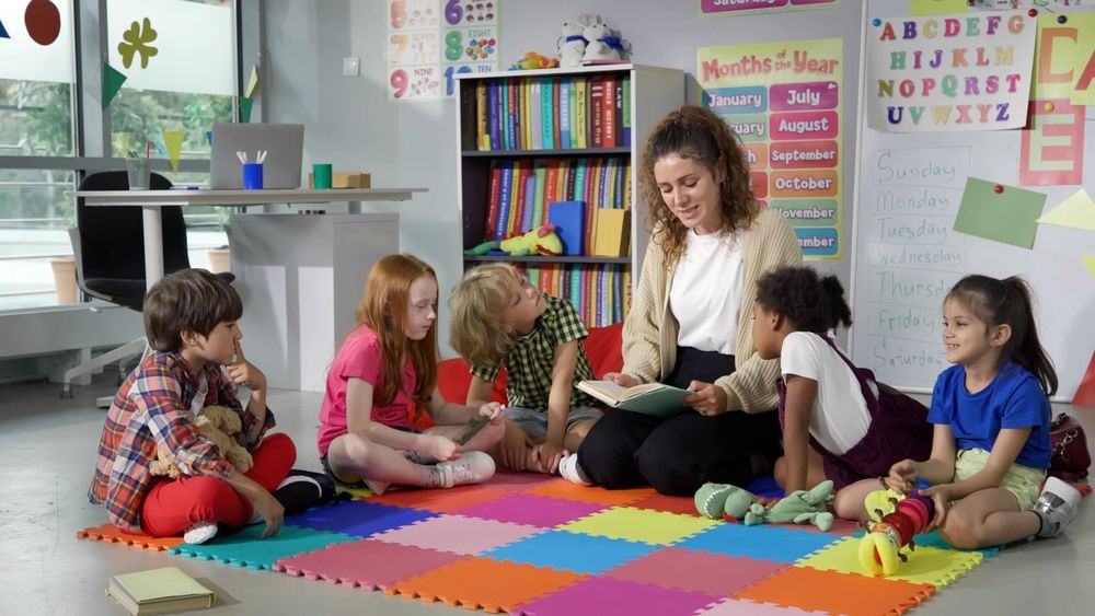 preschool kids with their teacher in a classroom