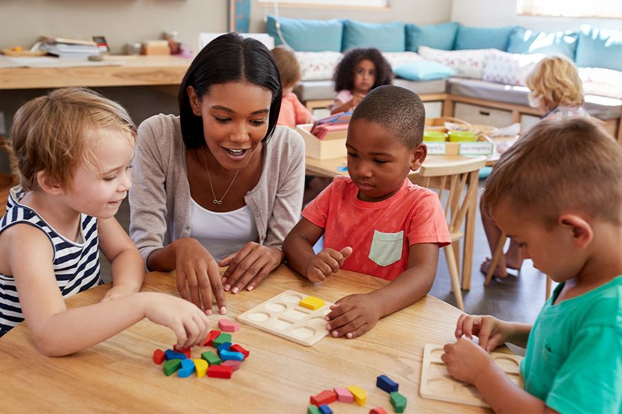 christian preschool teacher with her students