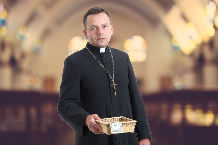 priest in church holding collection plate