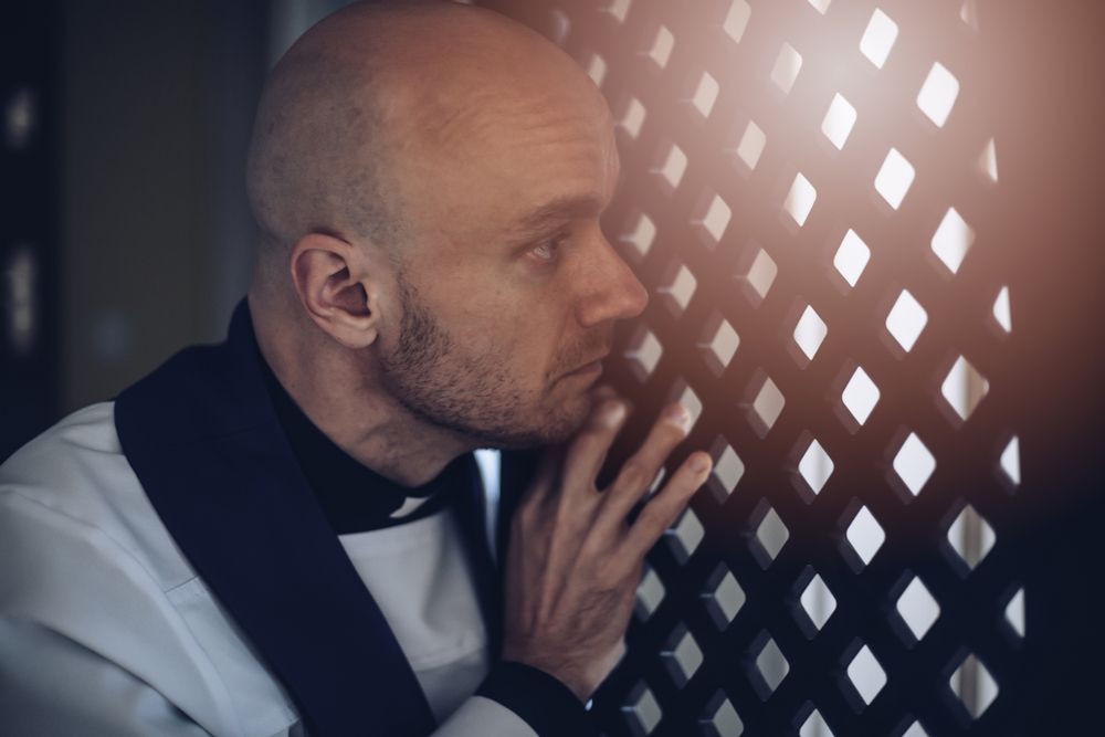 Priest in a confessional