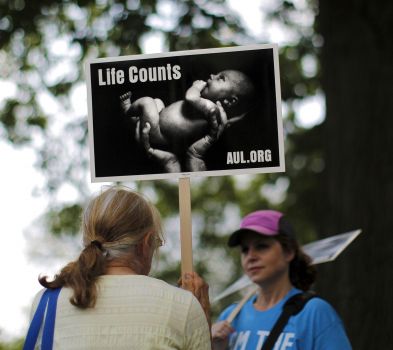 Pro-life activist holding a sign.