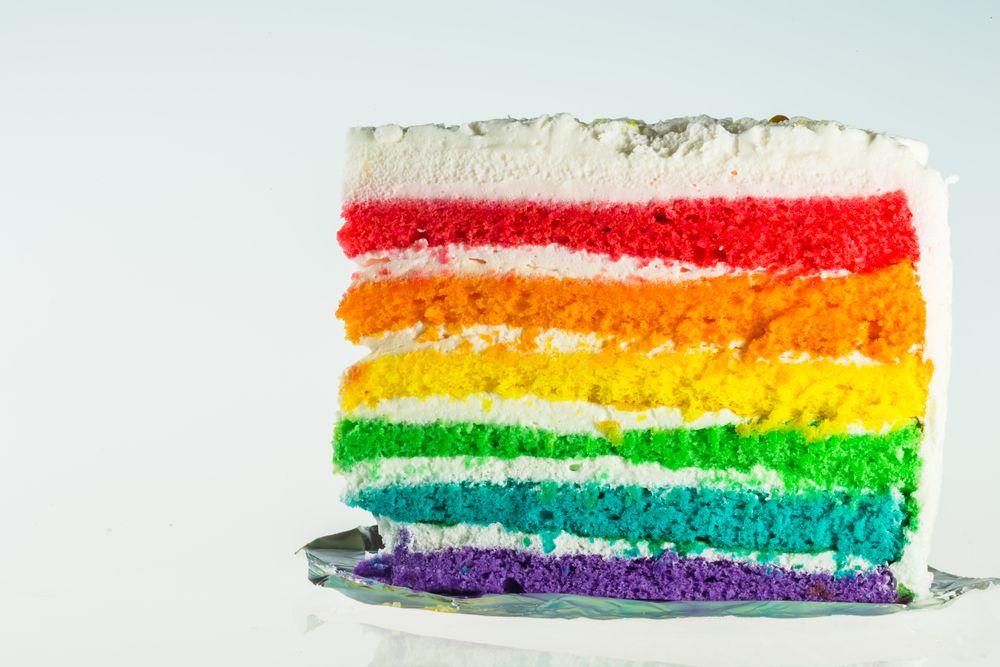 A slice of rainbow cake