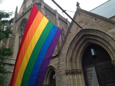 A church flying a rainbow flag