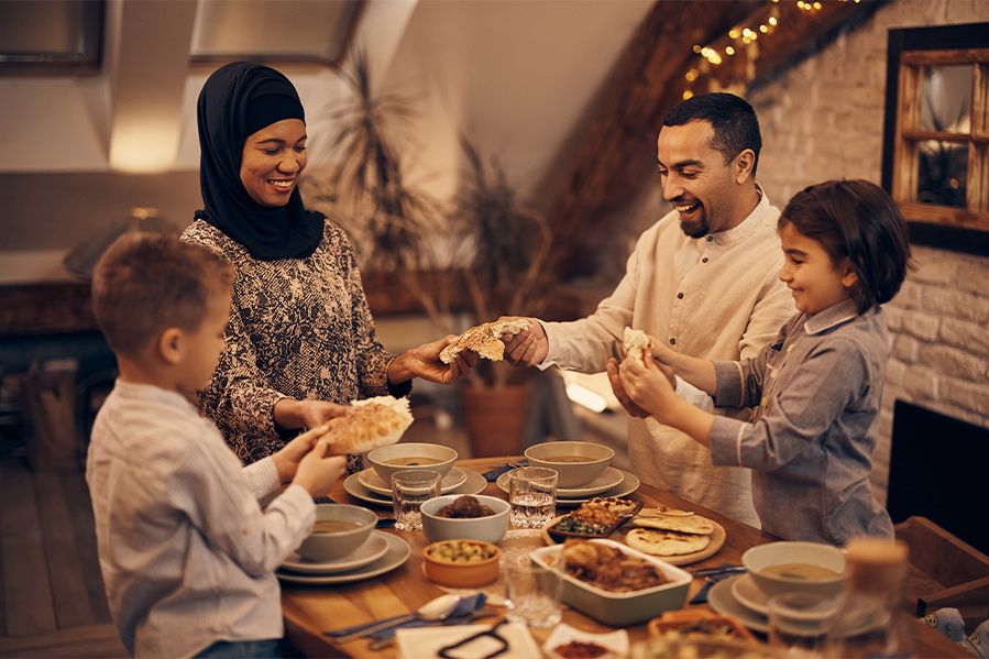 Muslim family enjoying sundown Ramadan feast